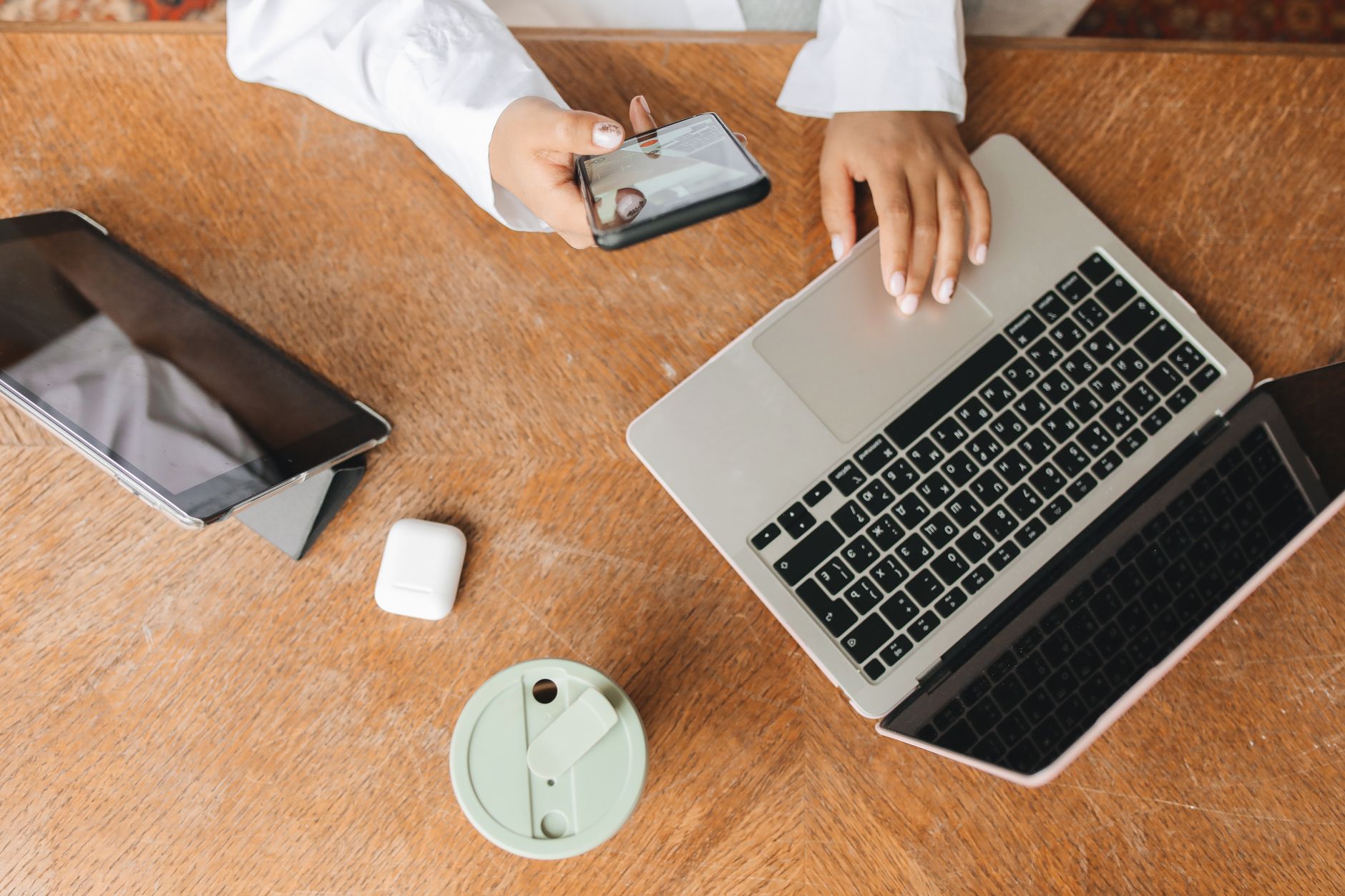 person in white dress shirt using laptop